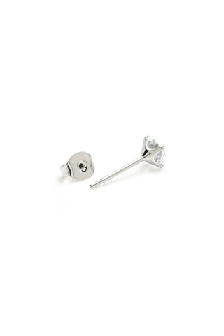 Pair of silver stud earrings on a white background