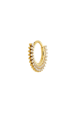 Gold hoop earring with embedded pearls on a white background