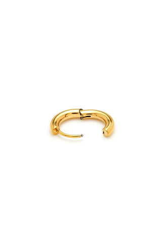 Gold hoop earring on a white background