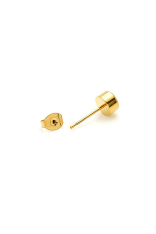 Gold stud earrings on a white background