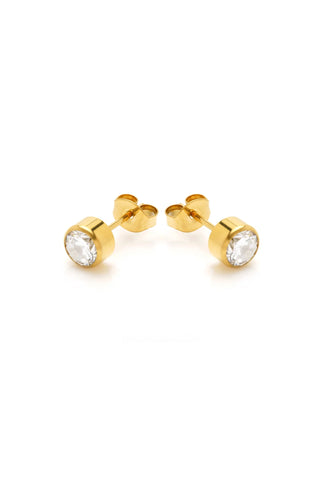 Gold stud earrings with clear gemstones on a white background