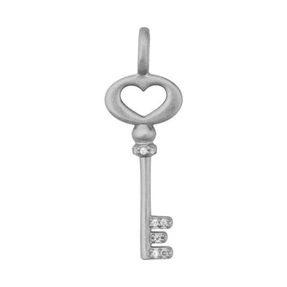 Silver key-shaped pendant with a heart design on a white background