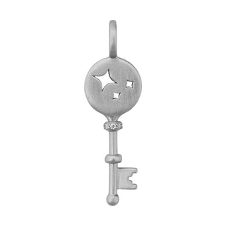 Silver key-shaped pendant with star cutout on a white background