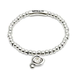 Silver beaded bracelet with a heart-shaped charm on a white background