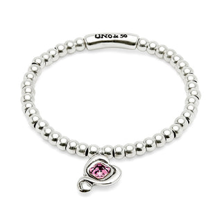 Silver beaded bracelet with a pink heart charm on a white background