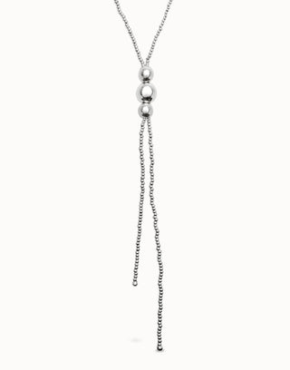 Silver necklace with a chain and spherical pendant on a white background
