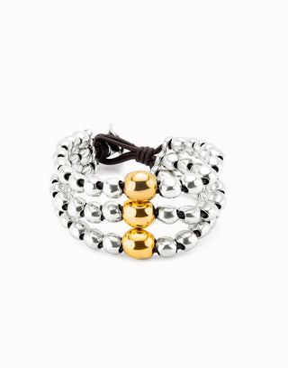 Bracelet with silver and gold beads on a white background