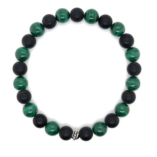 Bracelet with genuine malachite and black onyx beads on a white background