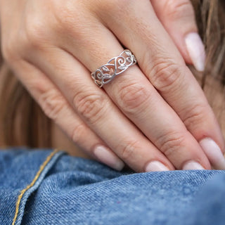 hand showing a clogau floral patterned ring