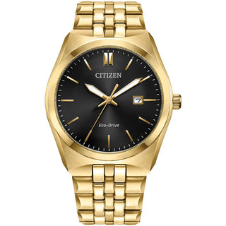 Gold Citizen watch with black dial on a white background