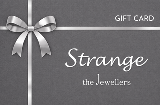 Gift card with a silver bow and 'Strange the Jewellers' branding on a gray background