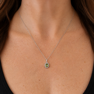 Necklace with a green pendant worn by a person