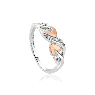 silver ring with rose gold vine leaf details.